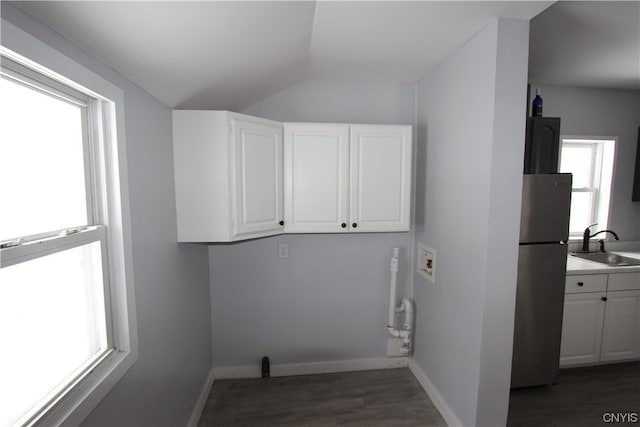 laundry room with washer hookup, dark wood-type flooring, and sink