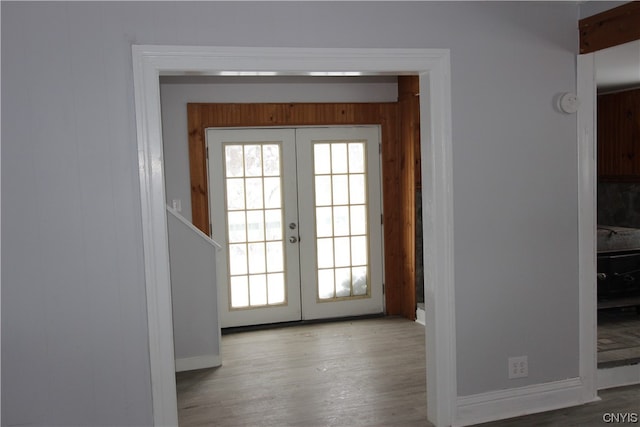 doorway to outside featuring light hardwood / wood-style floors and french doors