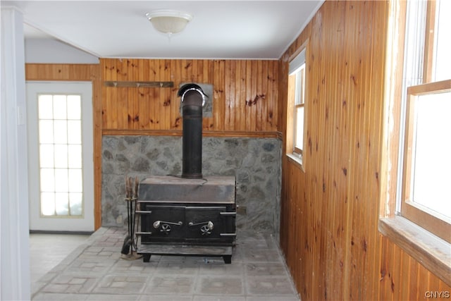 room details with wood walls and a wood stove