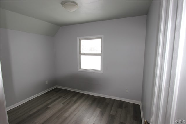 spare room with dark hardwood / wood-style floors