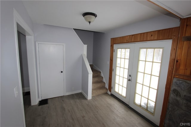 doorway to outside with light hardwood / wood-style floors and french doors