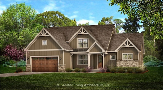 view of front of house with a front yard and a garage