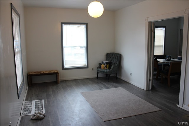 unfurnished room with dark hardwood / wood-style flooring