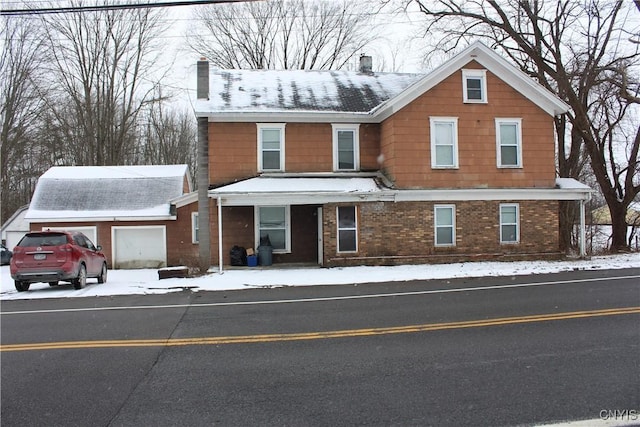 4966 State Route 31, Clay, NY 13041 - view of front of house with a chimney, an attached garage, brick siding, and driveway