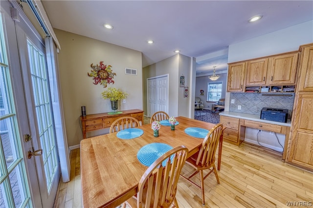 dining area featuring light hardwood / wood-style floors and french doors