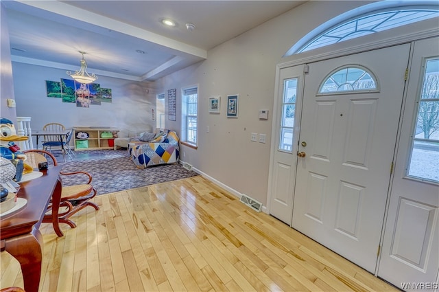 entrance foyer with a wealth of natural light and light wood-type flooring