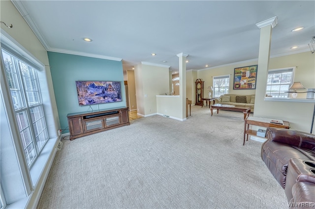 living room with light carpet, ornamental molding, and ornate columns