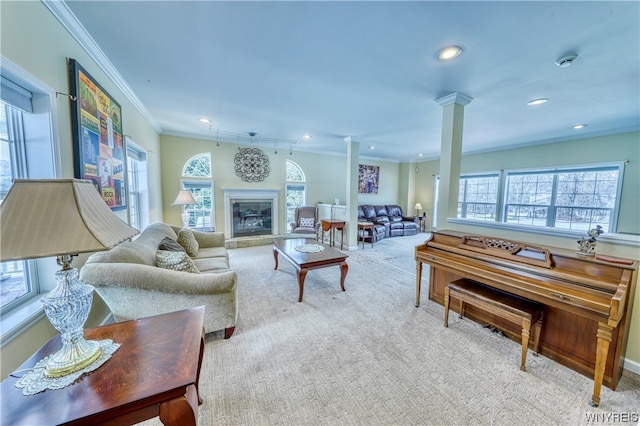 living room featuring light carpet, crown molding, and decorative columns