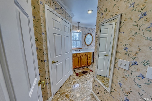 bathroom featuring crown molding, tile flooring, and vanity