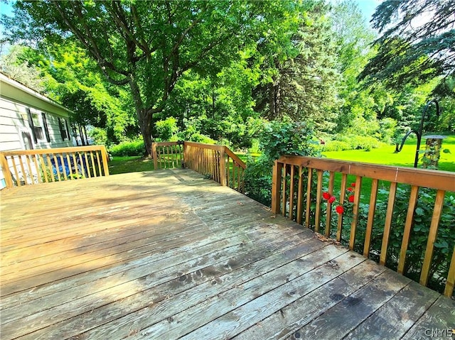 wooden terrace with a yard