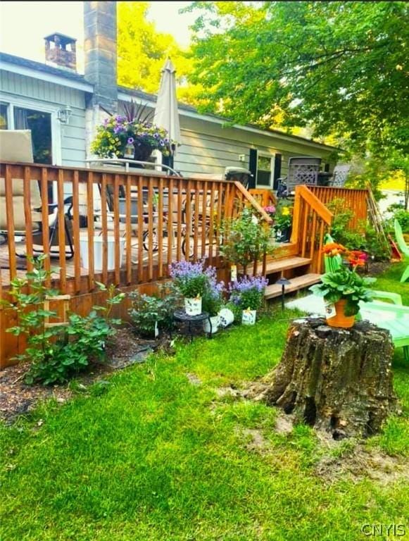 view of yard with a wooden deck