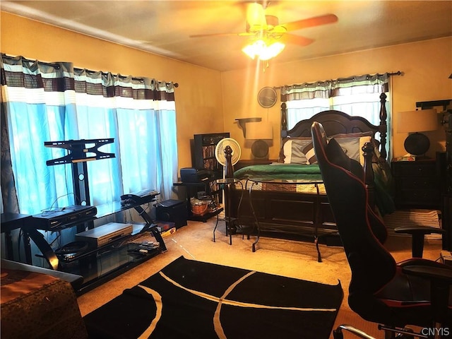 carpeted bedroom with ceiling fan