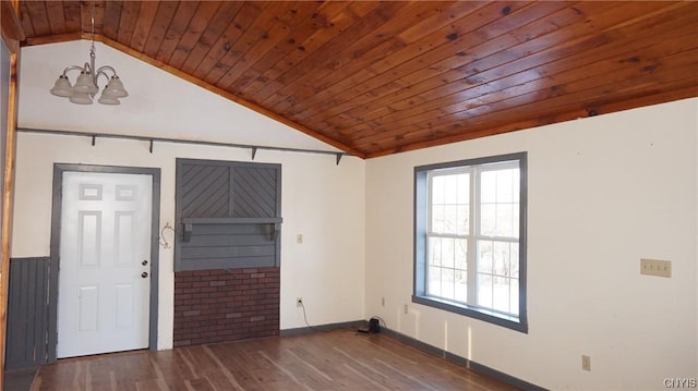 empty room featuring dark wood-type flooring, wooden ceiling, lofted ceiling, and an inviting chandelier