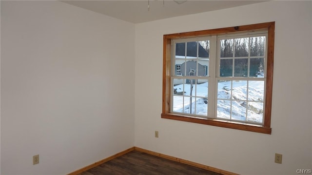 spare room with dark hardwood / wood-style flooring