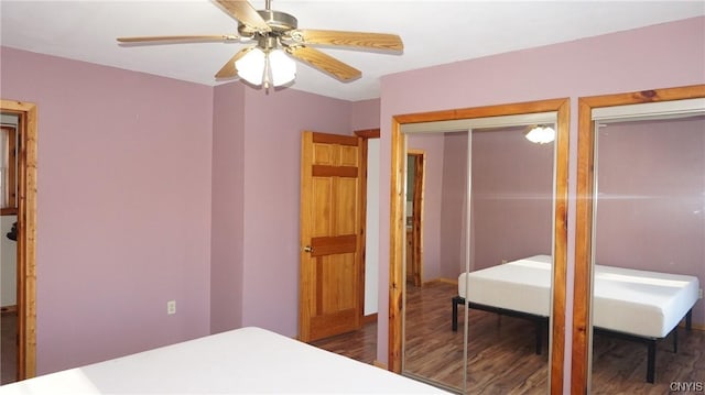 bedroom featuring ceiling fan and dark hardwood / wood-style flooring