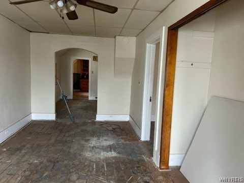 hallway with a paneled ceiling