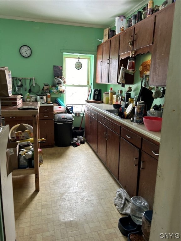 kitchen featuring dark brown cabinetry