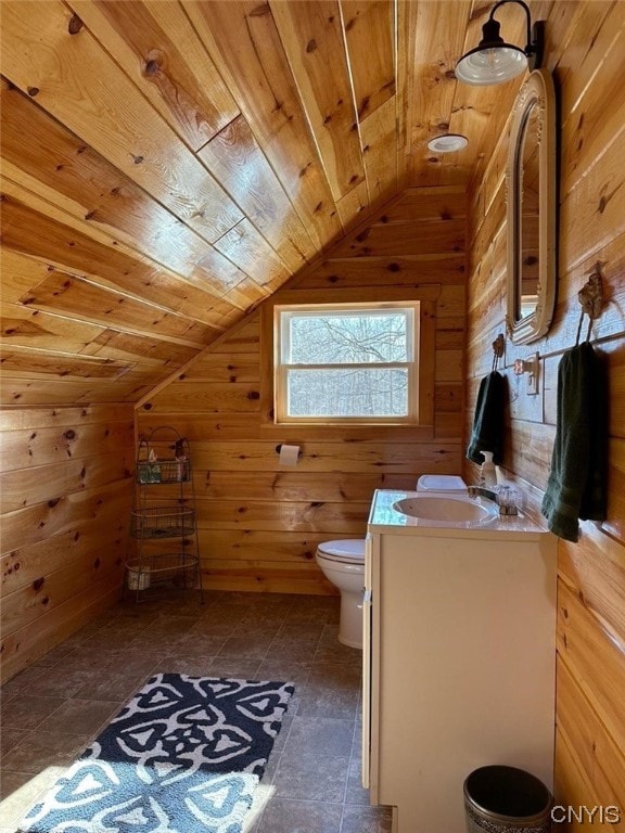 bathroom with toilet, lofted ceiling, vanity, wooden ceiling, and tile floors