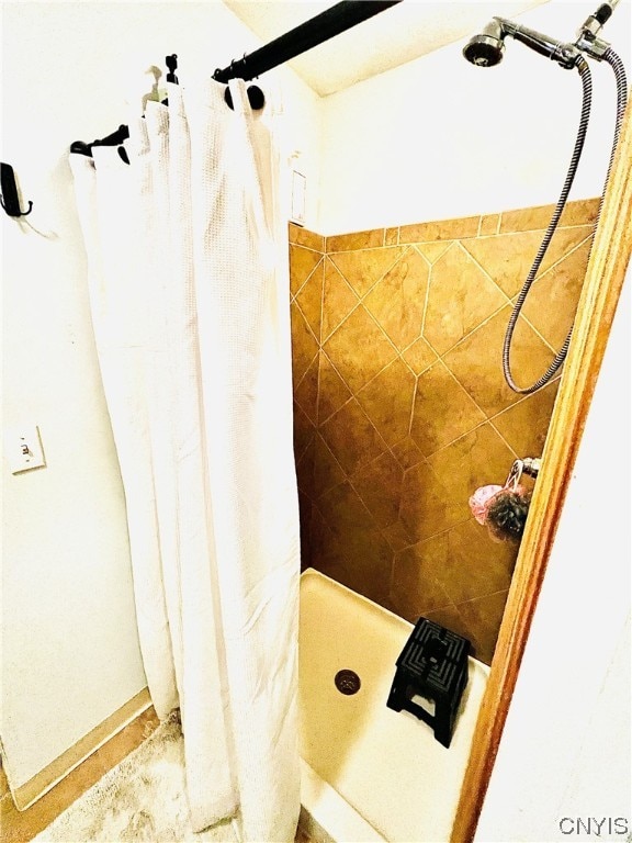 bathroom with a shower with shower curtain