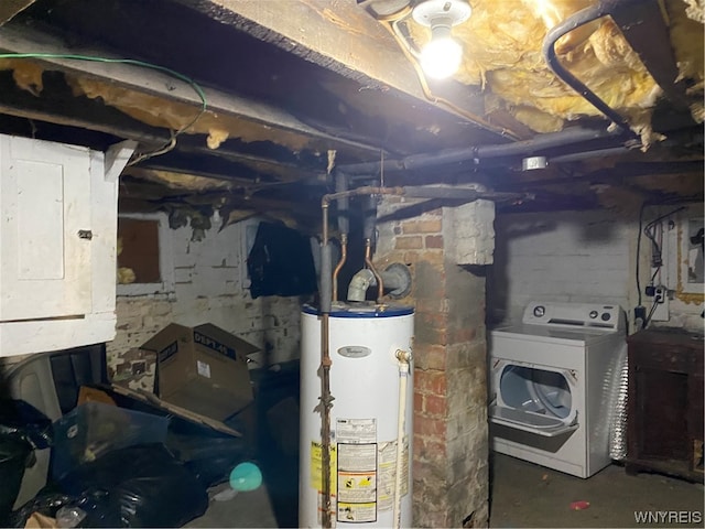 basement featuring water heater and washer / clothes dryer