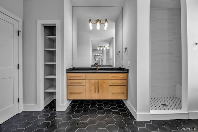 bathroom featuring vanity, tile floors, and a shower