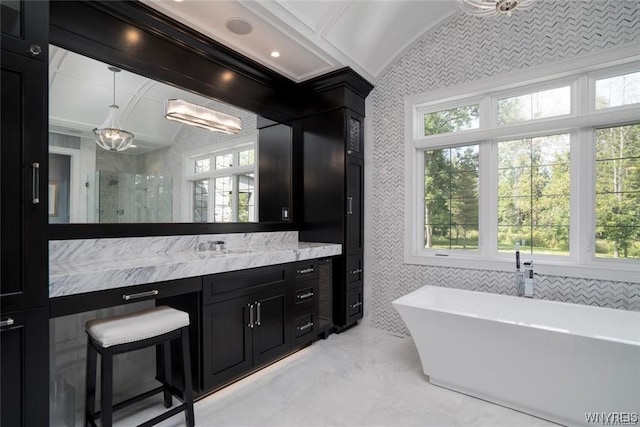 bathroom with oversized vanity, tile walls, a wealth of natural light, and tile floors