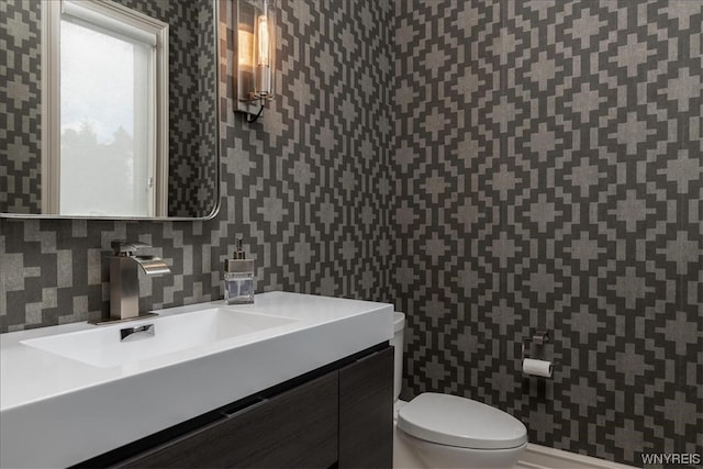 bathroom with vanity and toilet