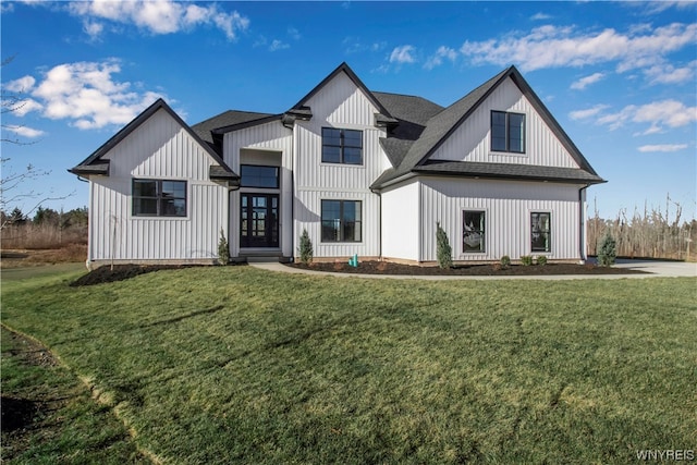 modern farmhouse featuring a front lawn