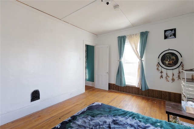 bedroom featuring hardwood / wood-style floors