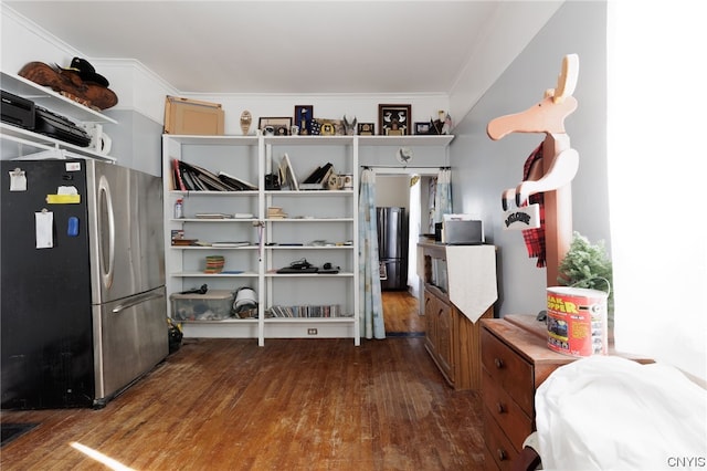 spacious closet with hardwood / wood-style flooring