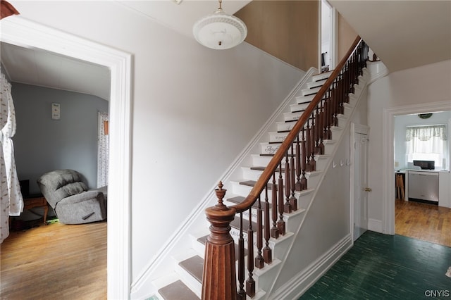 stairs with hardwood / wood-style flooring