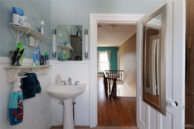 bathroom with hardwood / wood-style flooring