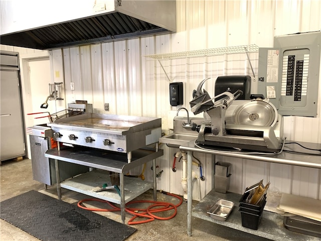 kitchen with sink, custom exhaust hood, and electric panel