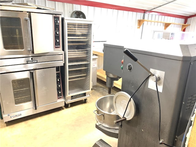 kitchen with concrete floors and oven