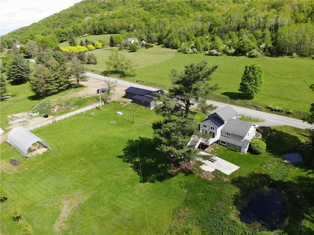 birds eye view of property with a rural view