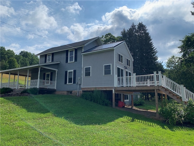 back of house featuring a lawn