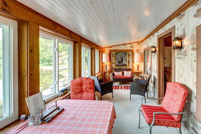 sunroom featuring wooden ceiling and vaulted ceiling