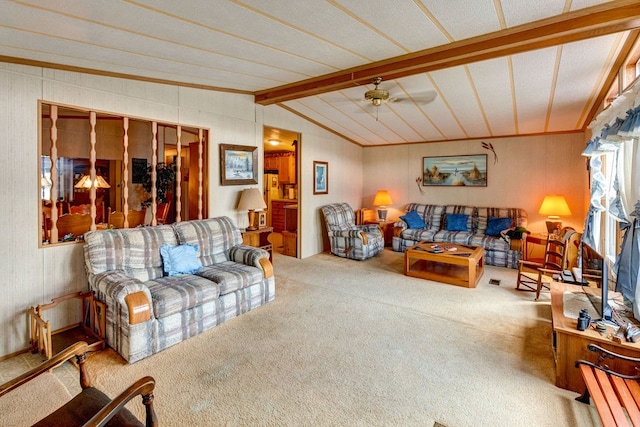 living room with vaulted ceiling with beams, carpet floors, ceiling fan, and crown molding