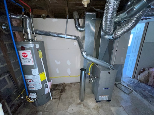 utility room with heating unit and water heater