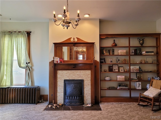 carpeted living room featuring an inviting chandelier and radiator