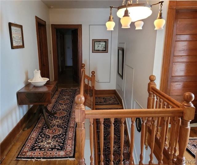 interior space with dark hardwood / wood-style floors and an inviting chandelier