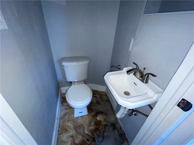 bathroom with toilet and sink