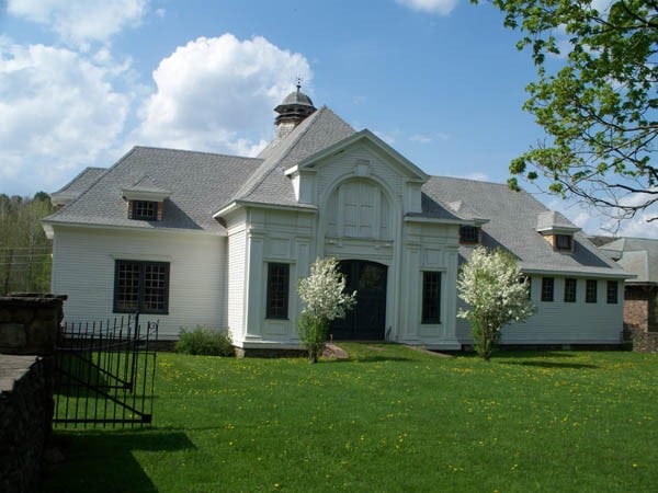 back of house with a lawn