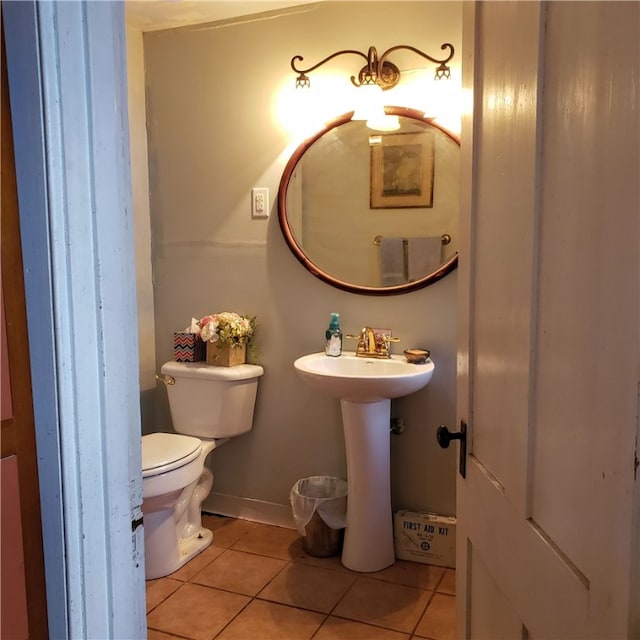 bathroom with toilet and tile flooring