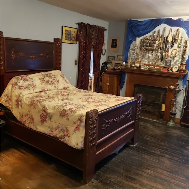 bedroom featuring dark hardwood / wood-style flooring