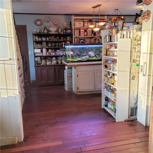 bar with white cabinets, decorative light fixtures, and dark wood-type flooring