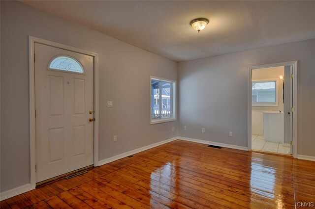 foyer entrance featuring a healthy amount of sunlight and light tile floors