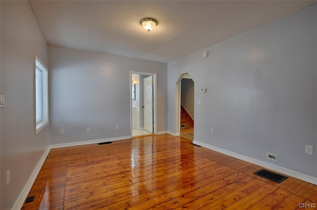 spare room with hardwood / wood-style flooring