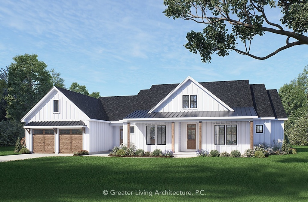 1204 Lake Point Dr, Webster, NY 14580 - view of front of house featuring board and batten siding, a standing seam roof, a garage, a front lawn, and concrete driveway