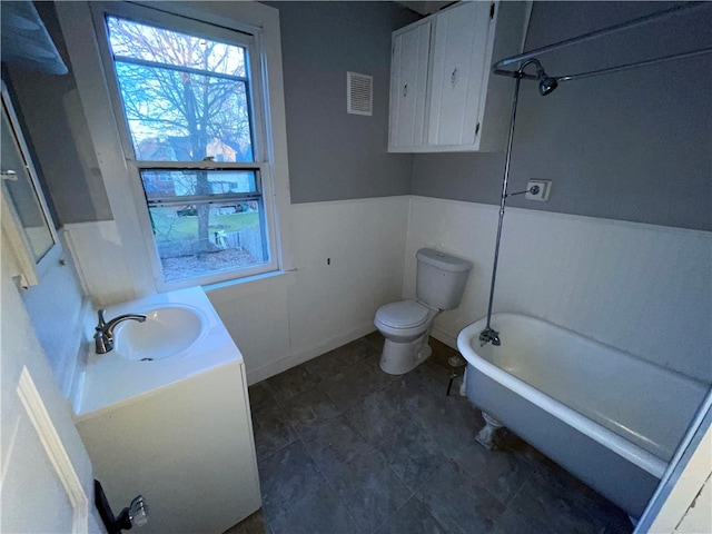 full bathroom featuring shower / bathing tub combination, vanity, and toilet